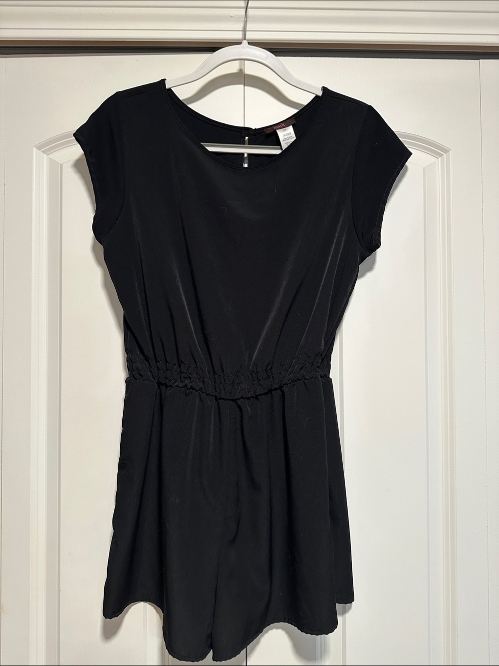 Mark black lightweight romper with open back keyhole feature